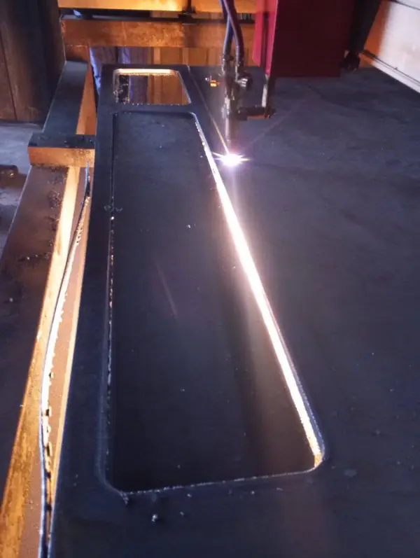 Clean rectangular opening cut in steel plate