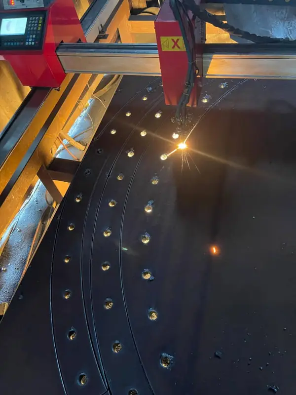 CNC plasma cutting a perforated steel plate