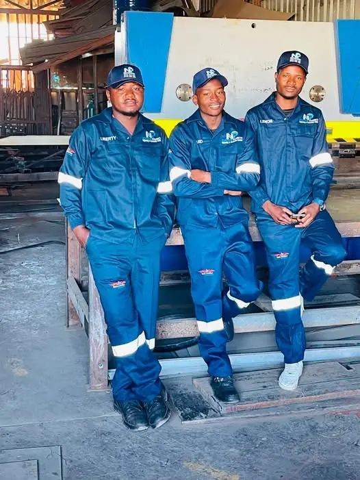 Noktech Projects fabrication team in branded workwear at the Harare workshop