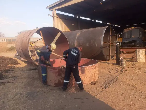 Rolled steel shells being prepared