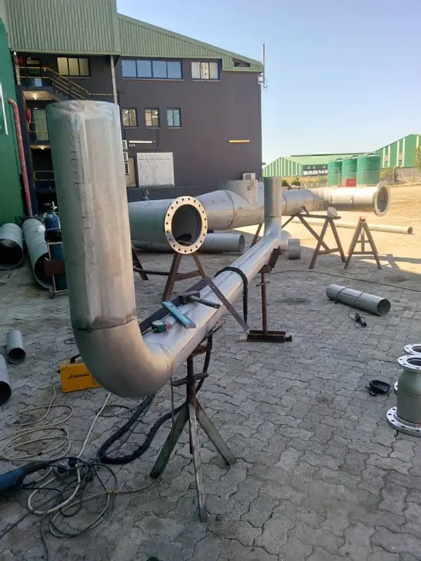 Stainless steel pipework with bends and flanges
