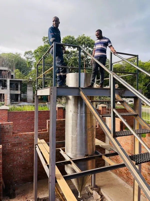 Steel access platform and stairs built around a process vessel