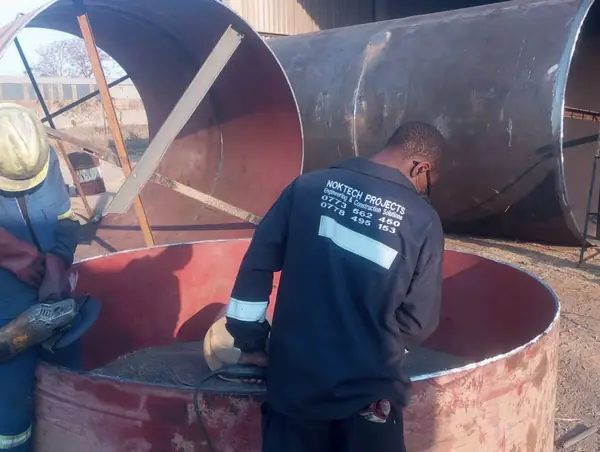 Grinding and finishing a tank shell