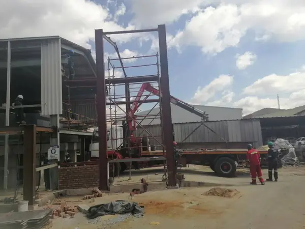Steel frame erection at an industrial site