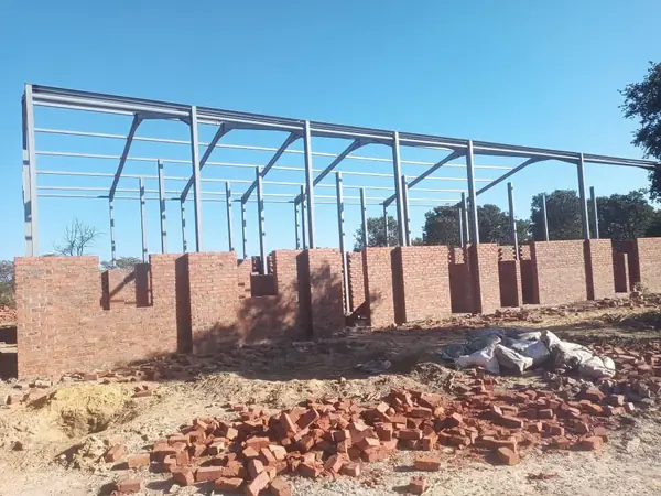 Structural steel roof trusses on site